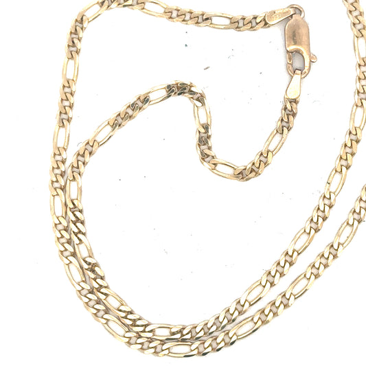 9ct yellow gold figaro chain weighing 9.2g, featuring interlinked flat and rounded links, displayed on a plain background.