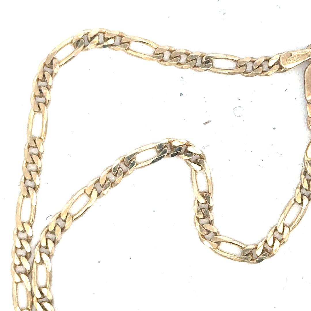 9ct yellow gold figaro chain weighing 9.2g, displayed with detailed links, unbranded jewelry accessory.