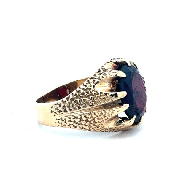 9ct yellow gold garnet ring in size N1/2, featuring a deep red garnet gemstone and a polished gold band.