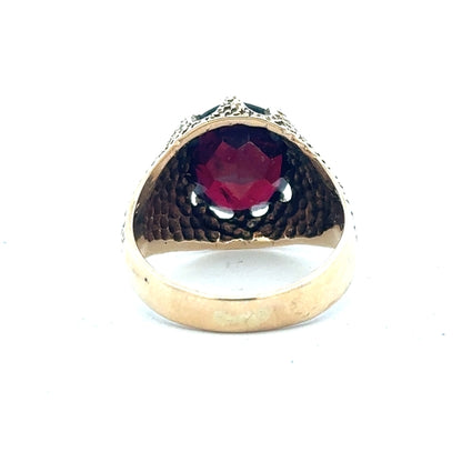 9ct yellow gold garnet ring in size N 1/2, featuring a polished gold band and a deep red garnet gemstone.