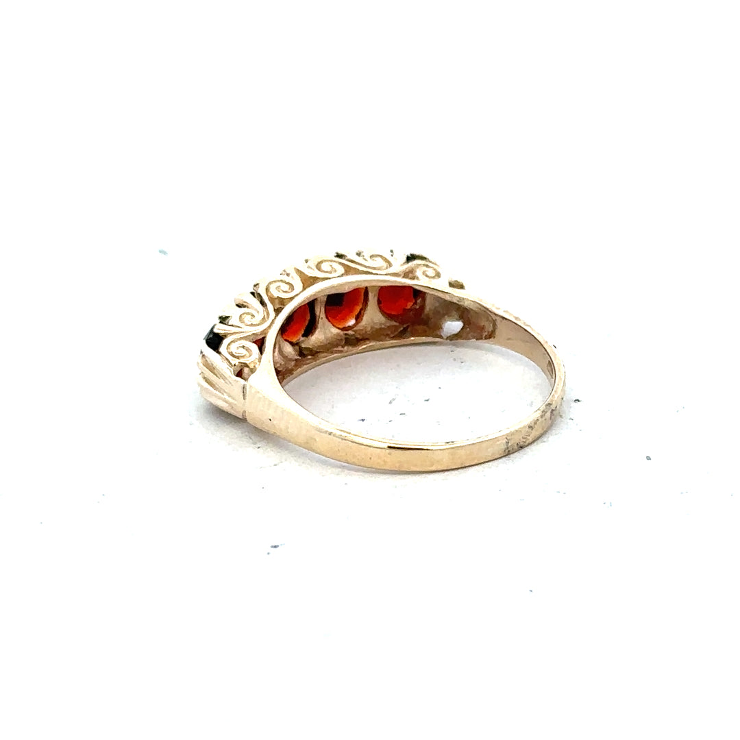 9ct yellow gold garnet ring in size S, featuring a vibrant garnet gemstone set in a polished gold band.