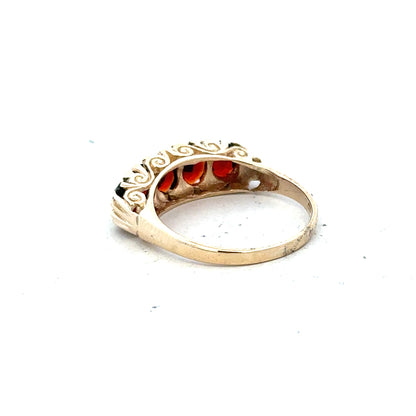 9ct yellow gold garnet ring in size S, featuring a vibrant garnet gemstone set in a polished gold band.