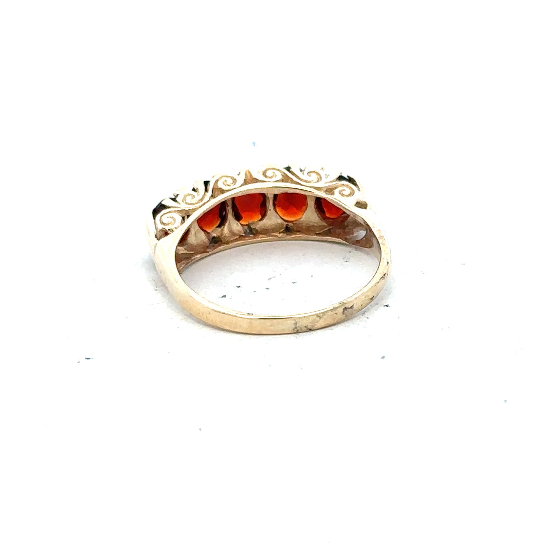9ct yellow gold garnet ring in size S with a round garnet gemstone set in an unbranded gold band.
