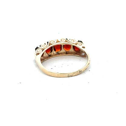 9ct yellow gold garnet ring in size S with a round garnet gemstone set in an unbranded gold band.