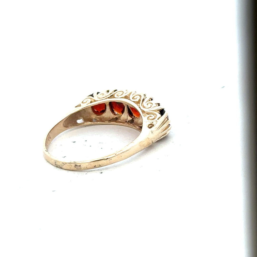 9ct yellow gold garnet ring in size S with a vibrant red gemstone, showcasing a classic unbranded jewelry design.