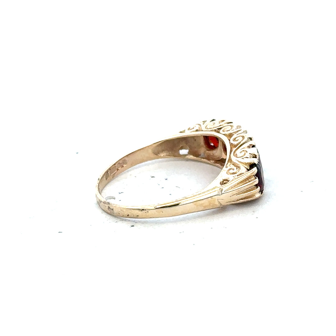 9ct yellow gold garnet ring in size S with a round garnet gemstone, unbranded jewelry, close-up view.