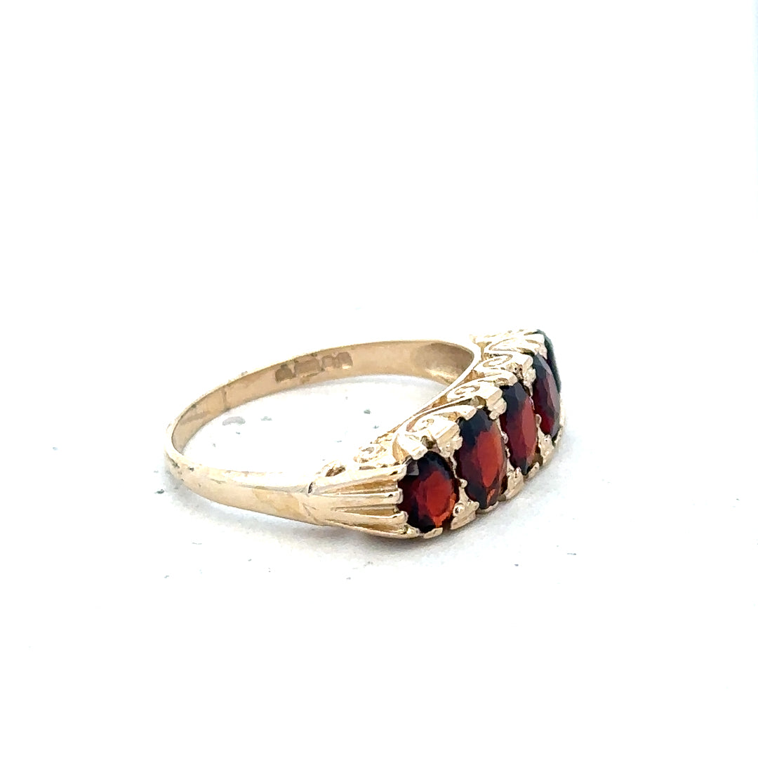 9ct yellow gold garnet ring in size S, featuring a vibrant garnet gemstone set in a polished gold band.