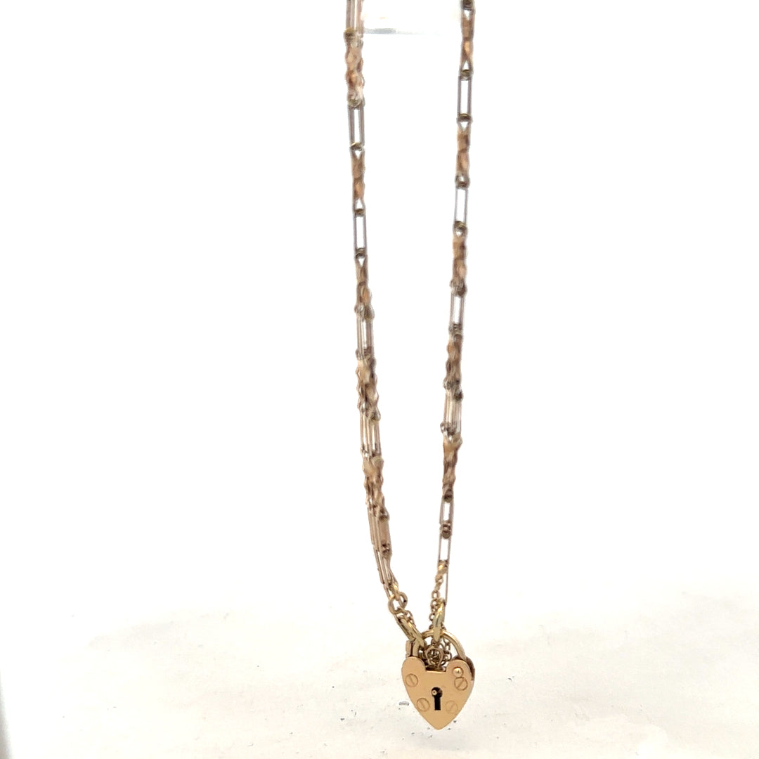 9ct yellow gold gate bracelet weighing 5.8g, featuring a classic chain design, unbranded gold jewelry accessory.