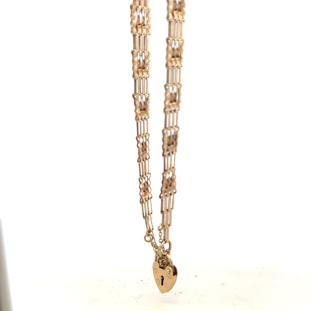 9ct yellow gold gate bracelet weighing 5.8g, unbranded, with linked chain design visible in the image.