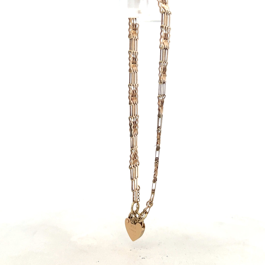 9ct yellow gold gate bracelet weighing 5.8g, unbranded, featuring linked chain design, shown in a close-up image.