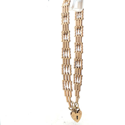 9ct yellow gold gate bracelet weighing 5.8g with a classic link design, unbranded jewelry for stylish wristwear.