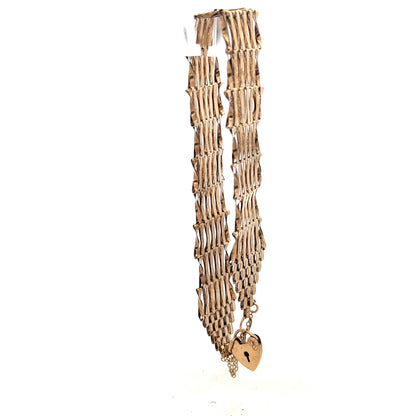 9ct yellow gold gate bracelet with a polished chain design, weighing 7.4 grams, showcasing fine craftsmanship and shine.