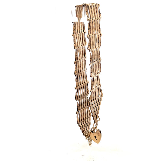 9ct yellow gold gate bracelet with a polished chain design, weighing 7.4 grams, showcasing fine craftsmanship and shine.