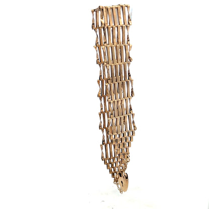 9ct yellow gold gate bracelet weighing 7.4g, unbranded, featuring classic chain links, displayed on a neutral background.