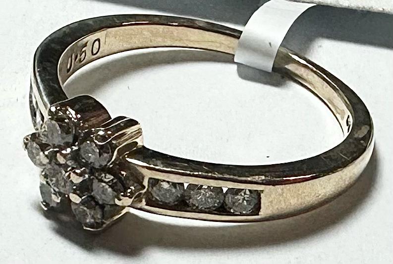 9ct yellow gold half-caret diamond ring in size M, featuring a sparkling diamond setting and elegant band design.
