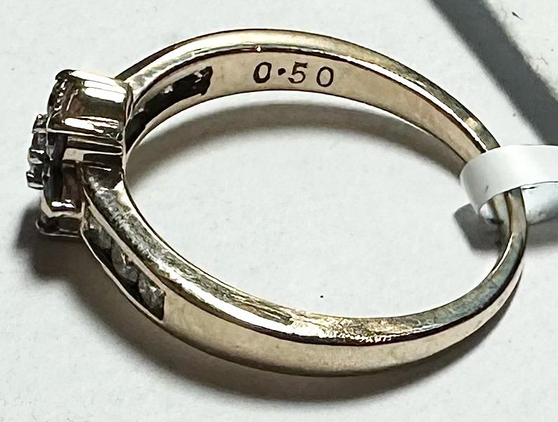 9ct yellow gold half-carat diamond ring in size M, showcasing a sparkling diamond setting on a sleek band.