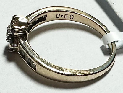 9ct yellow gold half-carat diamond ring in size M, showcasing a sparkling diamond setting on a sleek band.
