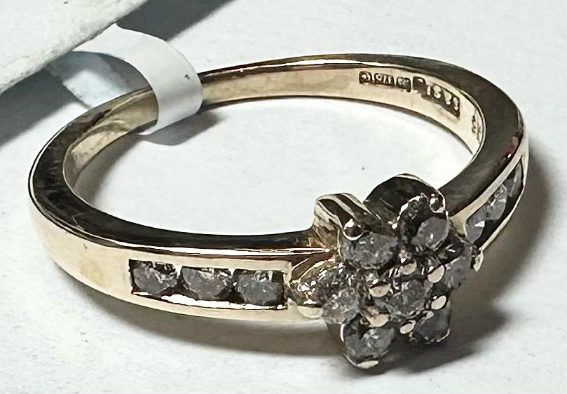 9ct yellow gold half-carat diamond ring in size M, showcasing a sparkling diamond set on a gold band.