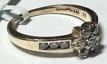 9ct yellow gold half-carat diamond ring in size M, featuring a sparkling diamond setting and a sleek band design.