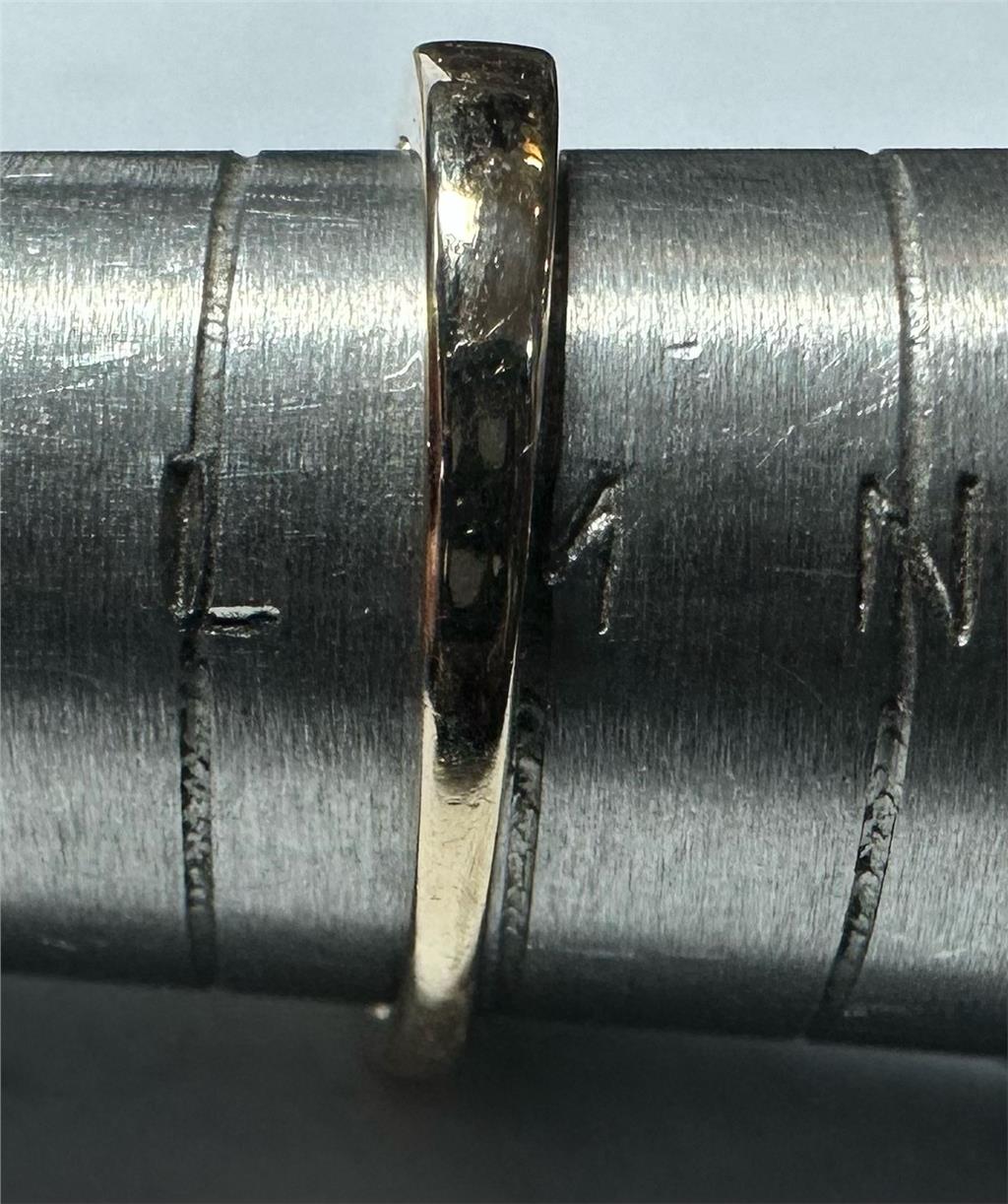 9ct yellow gold half-caret diamond ring in size M, featuring a sparkling diamond set in a sleek gold band.