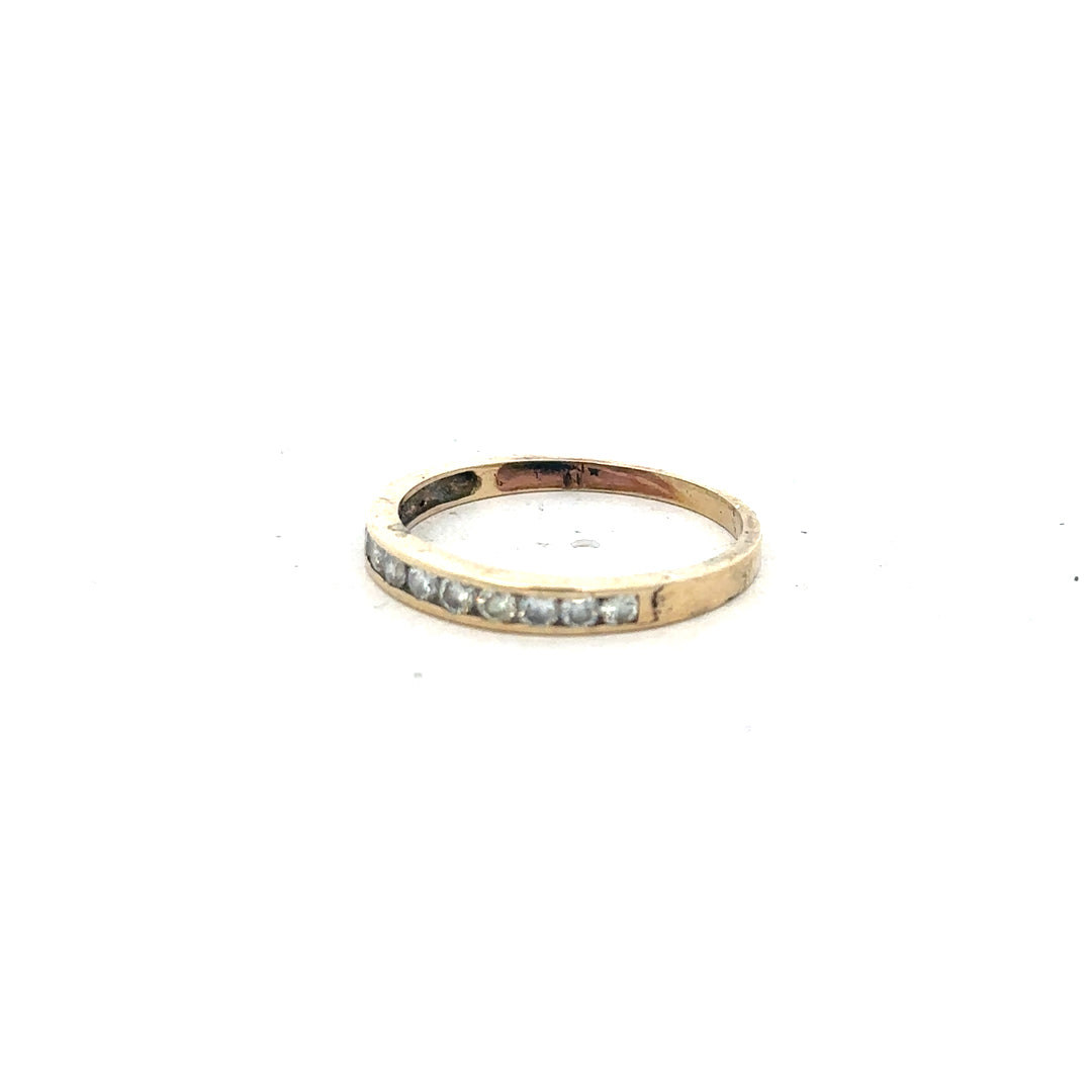 9ct yellow gold half eternity diamond ring in size N with sparkling diamonds, featuring a sleek and elegant design.