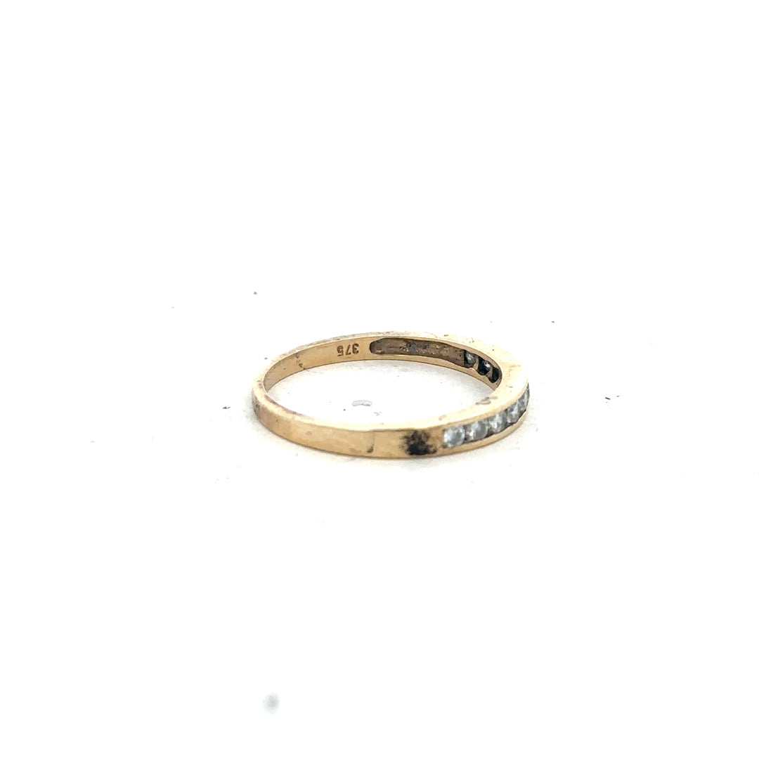 9ct yellow gold half eternity diamond ring in size N, featuring a row of sparkling diamonds on an elegant band.