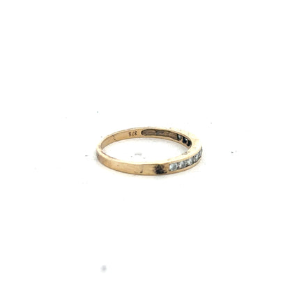 9ct yellow gold half eternity diamond ring in size N, featuring a row of sparkling diamonds on an elegant band.