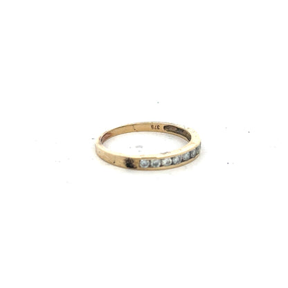 9ct yellow gold half eternity diamond ring in size N, featuring a row of sparkling diamonds set in a gold band.