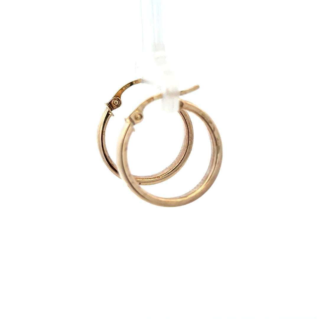 9ct yellow gold hoop earrings weighing 1.1g, unbranded jewelry with classic round design, shiny finish, and secure clasp.