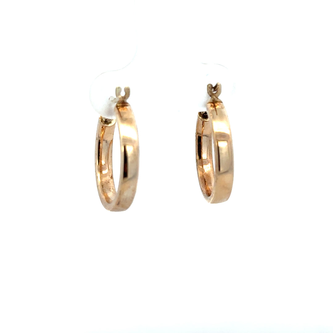 9ct yellow gold hoop earrings, lightweight 1.1g, with a classic circular design, shown in a close-up image.