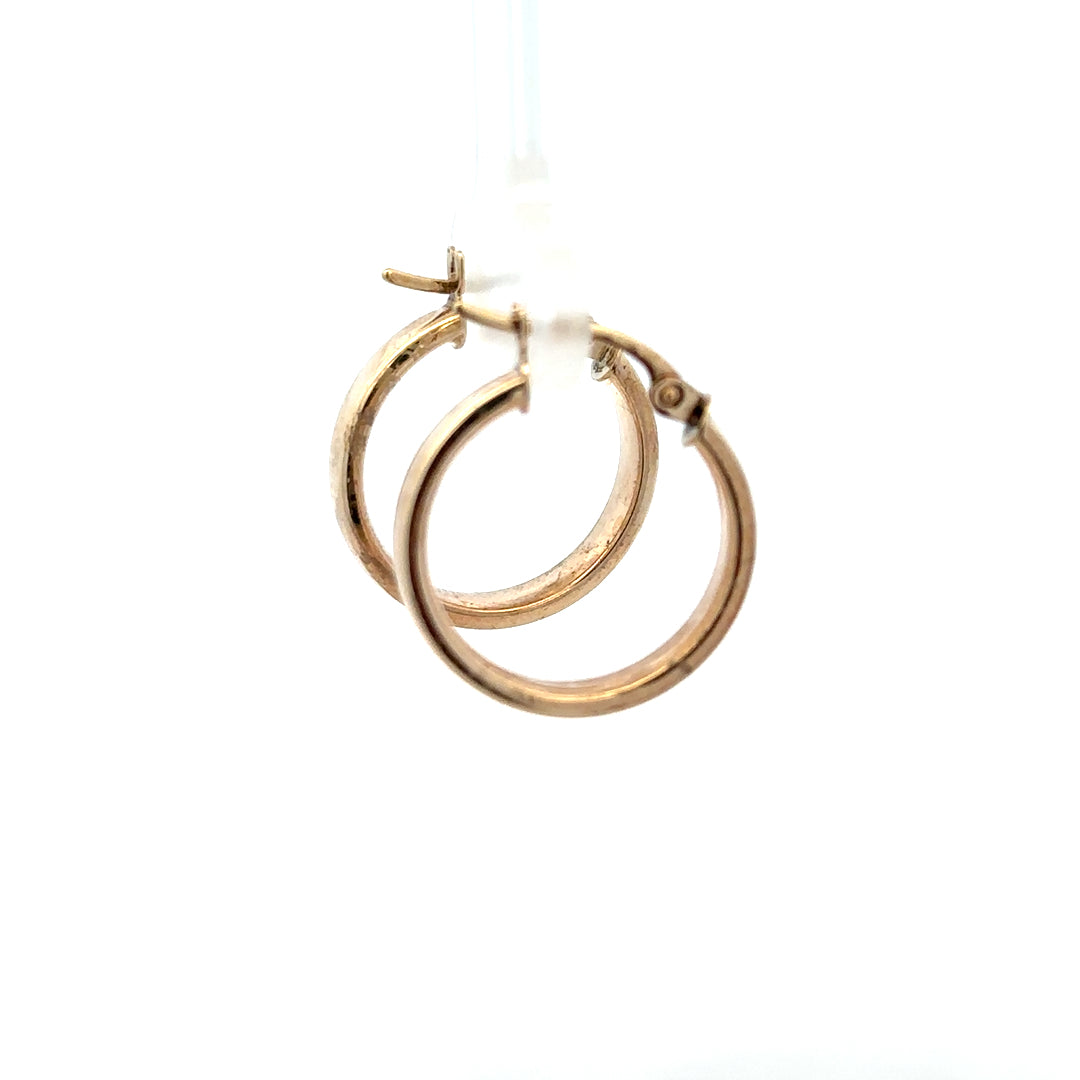 9ct yellow gold hoop earrings weighing 1.1g, stylish jewelry accessory with a classic hoop design in warm gold tone.