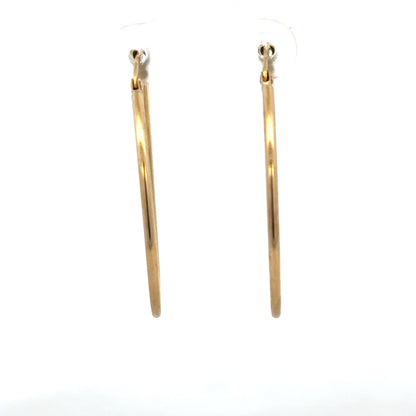 9ct yellow gold hoop earrings weighing 1.1g, unbranded, with a classic circular design and polished finish