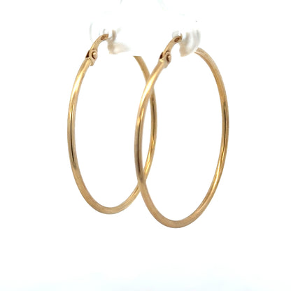 9ct yellow gold hoop earrings weighing 1.1g, unbranded, with a classic circular design and polished finish.