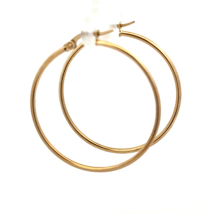 9ct yellow gold hoop earrings, lightweight 1.1g, with a classic circular design, shown in a close-up image.