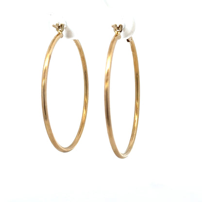 9ct yellow gold hoop earrings weighing 1.1g, featuring a classic circular design and smooth polished finish.