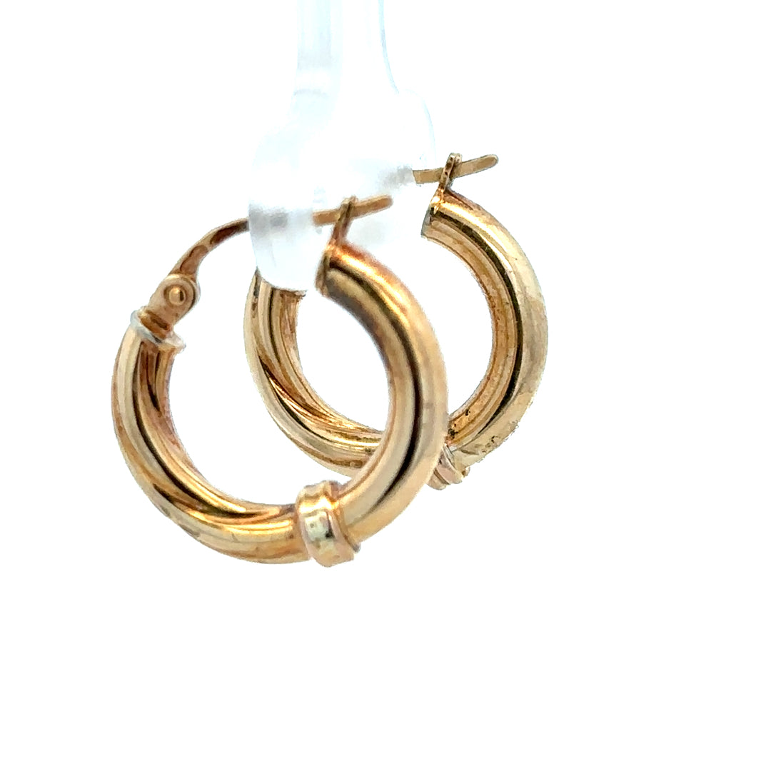 9ct yellow gold hoop earrings weighing 1.5g, featuring a classic round design, shown against a plain background.