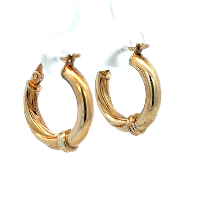 9ct yellow gold hoop earrings weighing 1.5g, featuring a classic circular design, ideal for everyday elegant jewelry wear