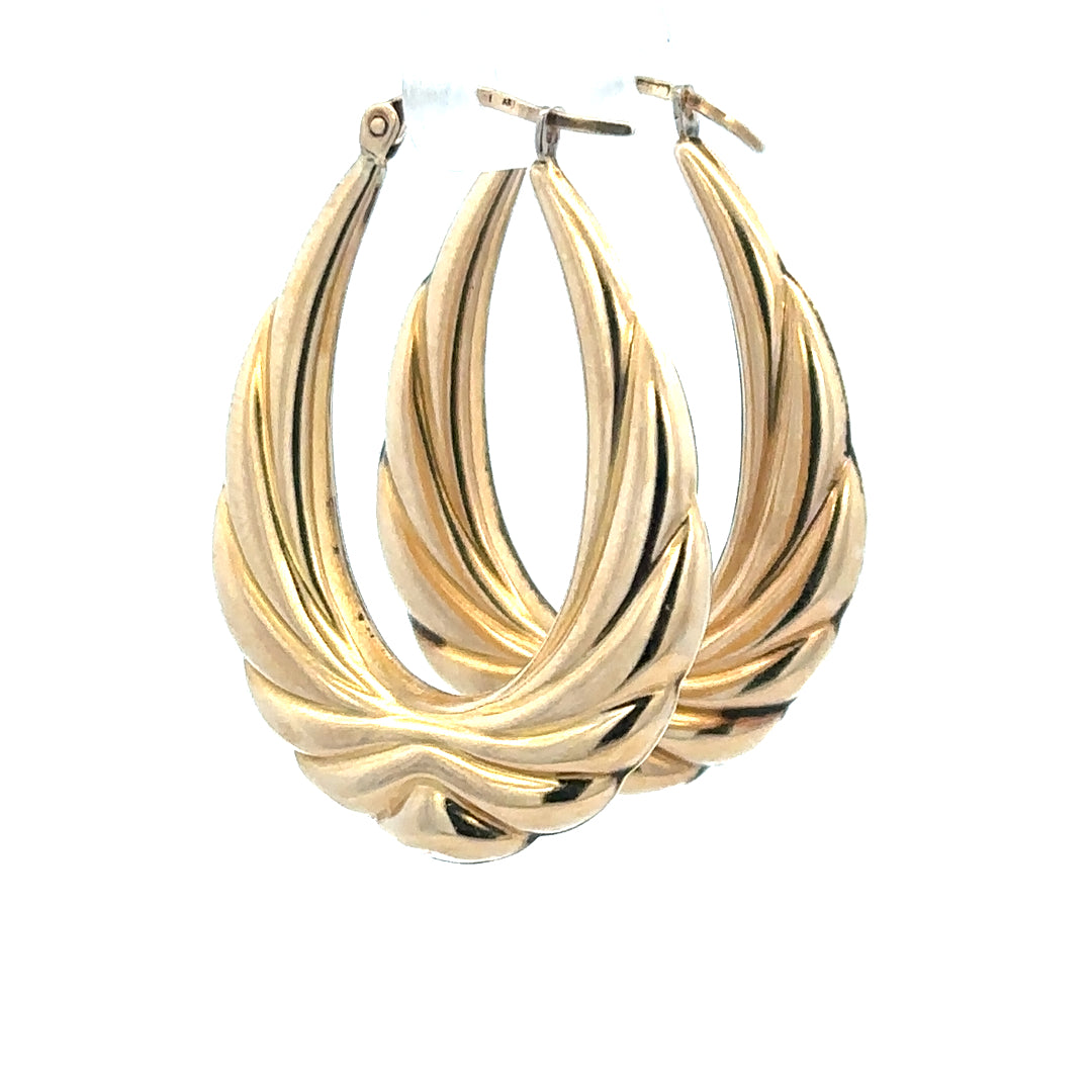 9ct yellow gold hoop earrings weighing 3.8g, featuring a classic circular design, unbranded jewelry accessory with a polished finish.