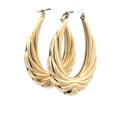 9ct yellow gold hoop earrings weighing 3.8g, featuring classic round design, unbranded jewelry with polished finish.