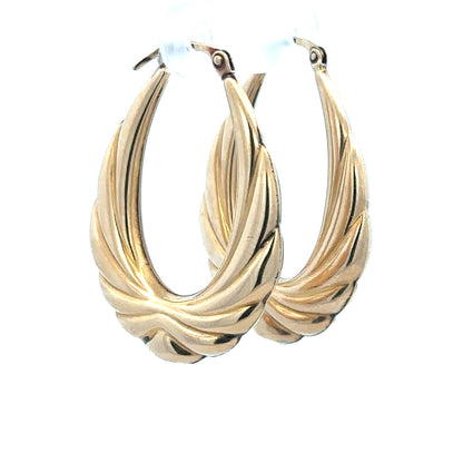 9ct yellow gold hoop earrings weighing 3.8g with a classic design, suitable for everyday wear and stylish accessories.