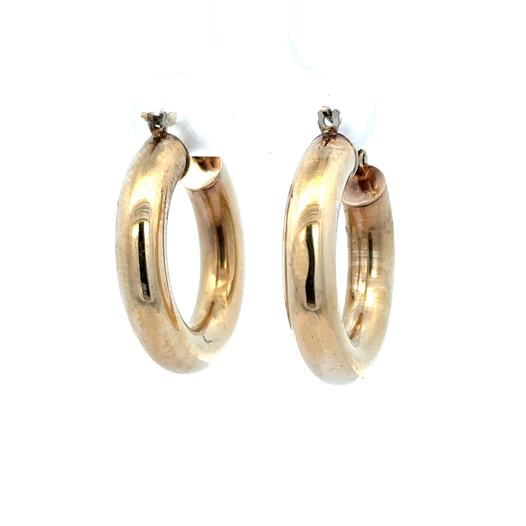 9ct yellow gold hoop earrings weighing 3.9g, showcasing simple, elegant jewelry with a polished finish