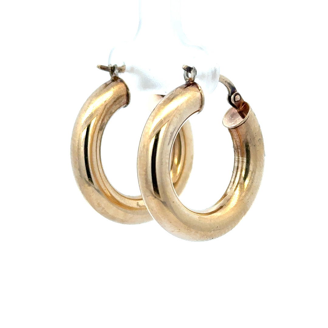 9ct yellow gold hoop earrings weighing 3.9g, unbranded, with a smooth circular design and polished finish.