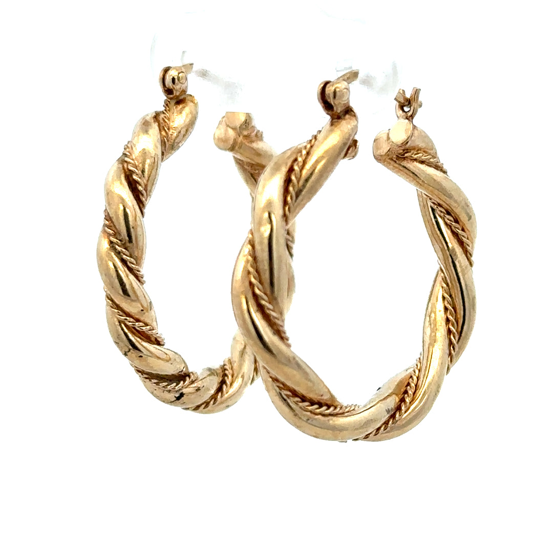 9ct yellow gold hoop earrings weighing 4.9g, featuring a classic round design and polished finish.