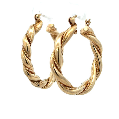 9ct yellow gold hoop earrings weighing 4.9g, featuring a classic round design and polished finish.
