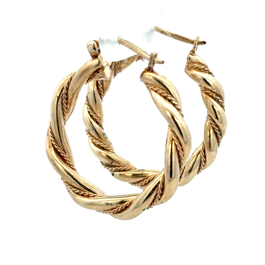 9ct yellow gold hoop earrings, unbranded, 4.9g, shiny and smooth round hoops shown in a close-up image.