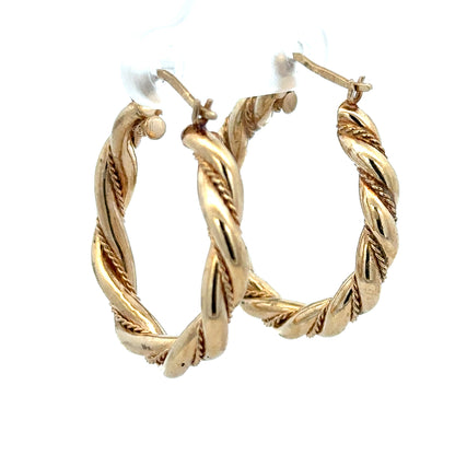 9ct yellow gold hoop earrings weighing 4.9g, showcasing classic round design with a polished finish.