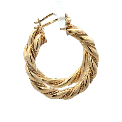 9ct yellow gold hoop earrings weighing 4.9g, featuring a classic round design and polished finish.