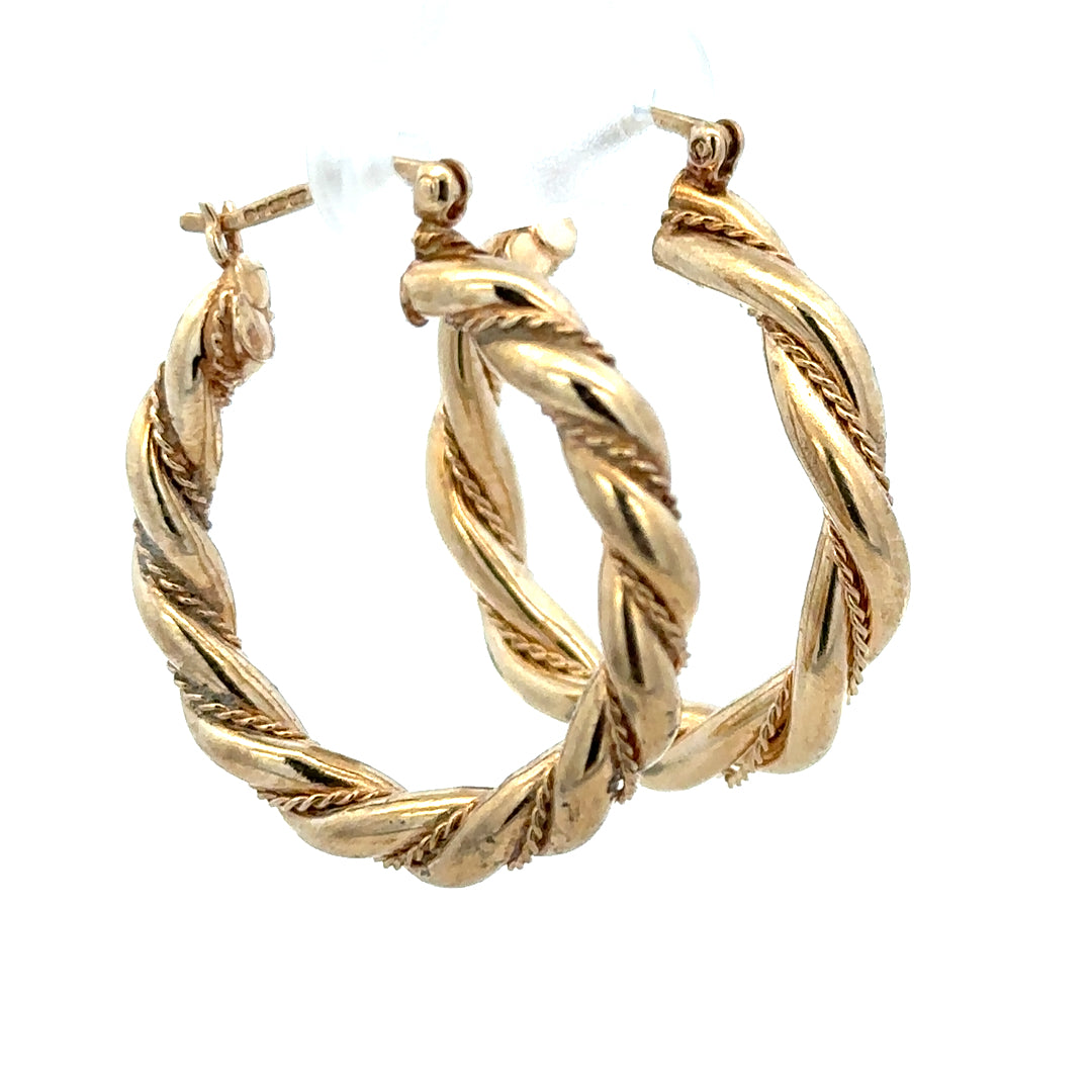 9ct yellow gold hoop earrings weighing 4.9g, unbranded, shiny circular jewelry with a classic hoop design.