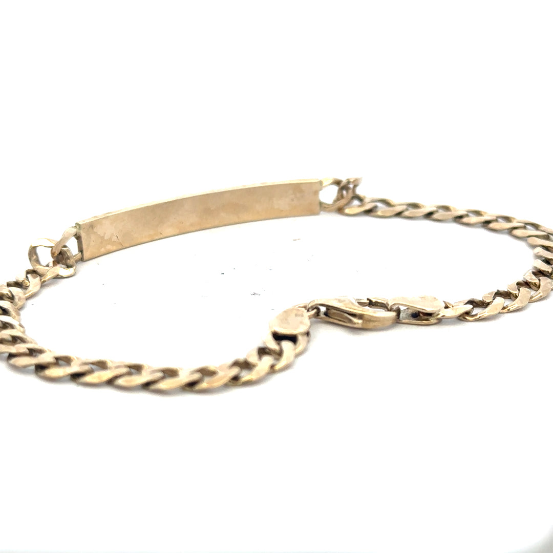 9ct yellow gold ID bracelet weighing 11.6g with a sleek, polished finish, featuring a customizable ID plate and linked chain.