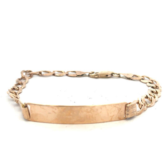 9ct yellow gold ID bracelet weighing 9.7g, featuring a sleek, polished design with a customizable ID plate.